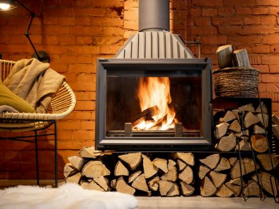 Burning fireplace with firewood at home
